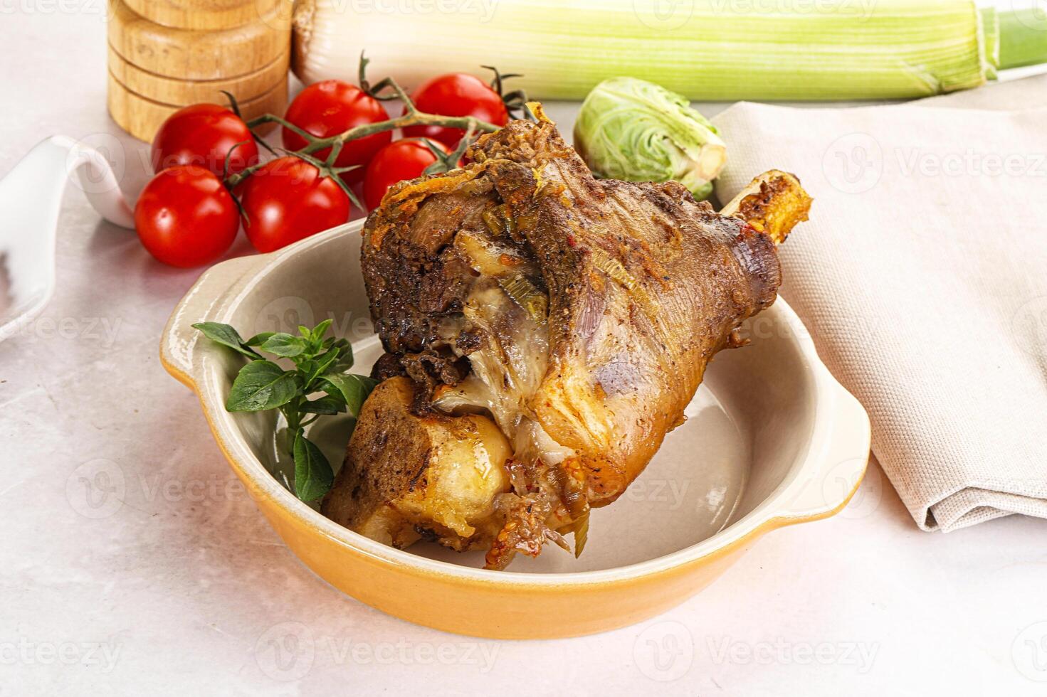 A bowl of food with a piece of meat in it photo