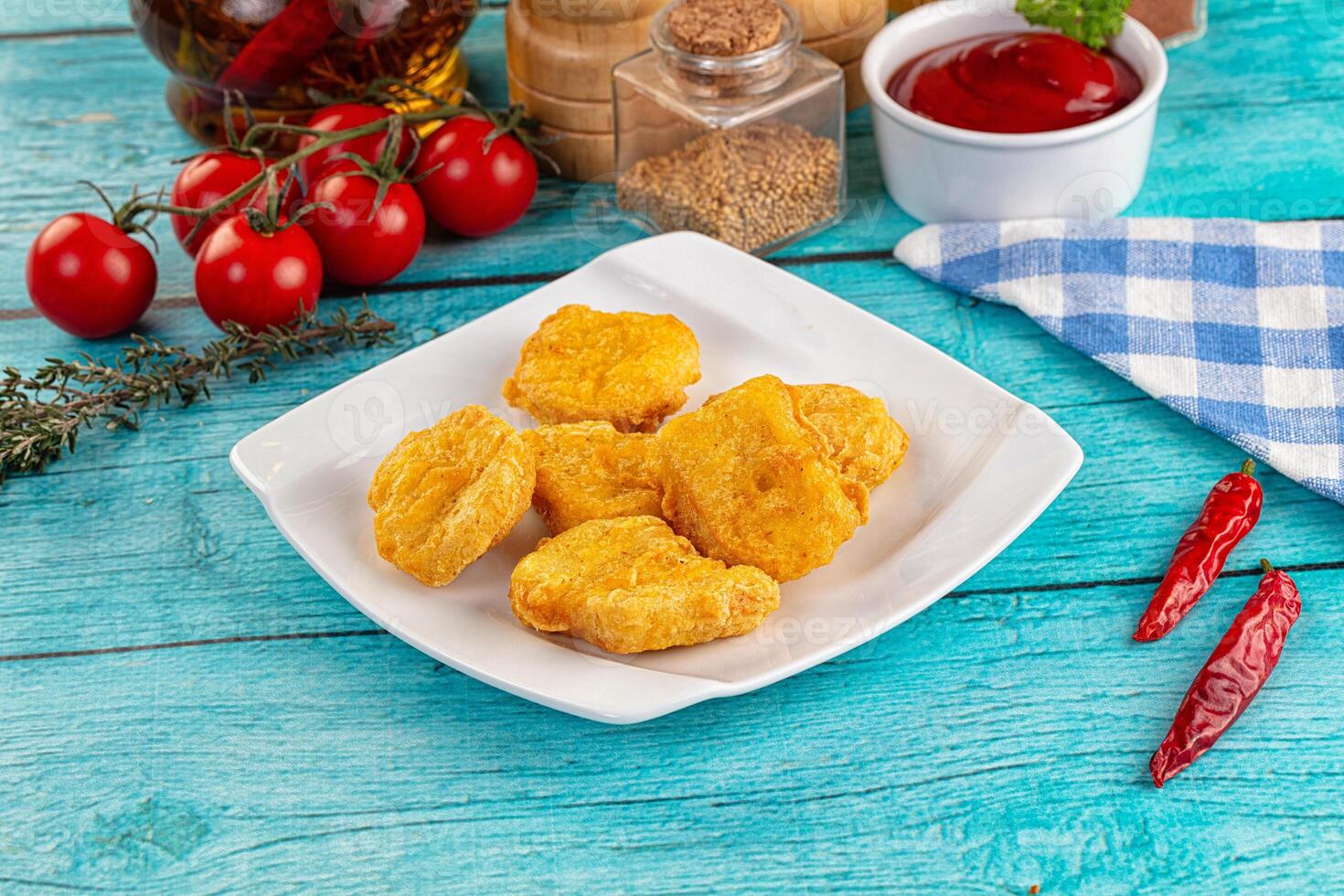 A plate of food on a blue table photo