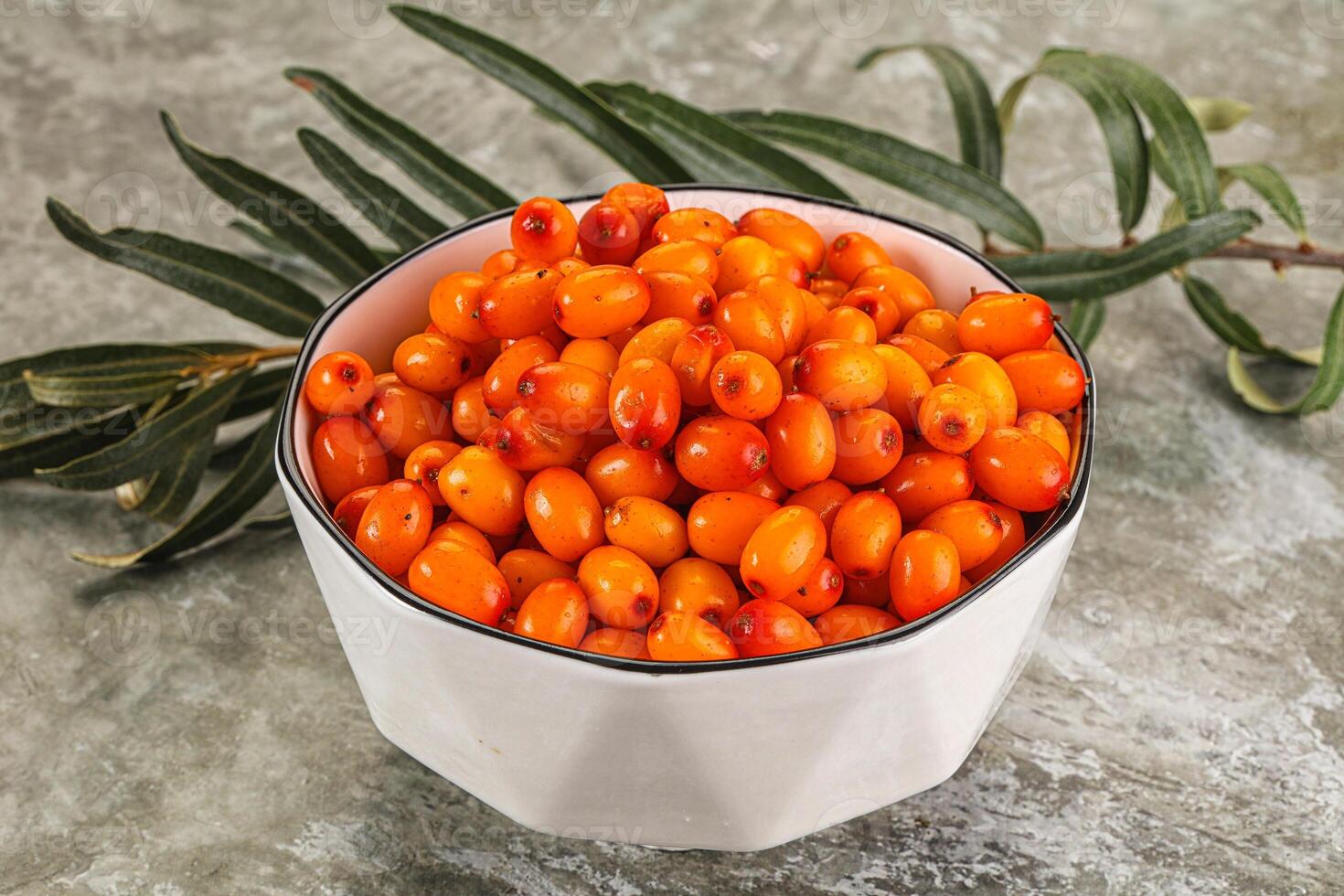 A bowl of orange berries photo