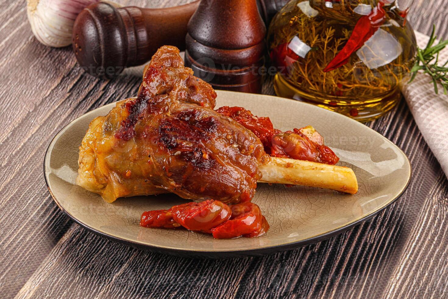 A plate of food with a meat dish on it photo
