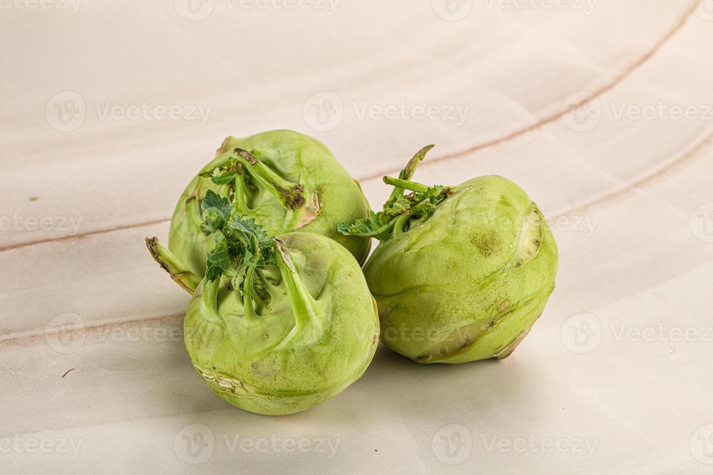Three green fruits on a white plate photo