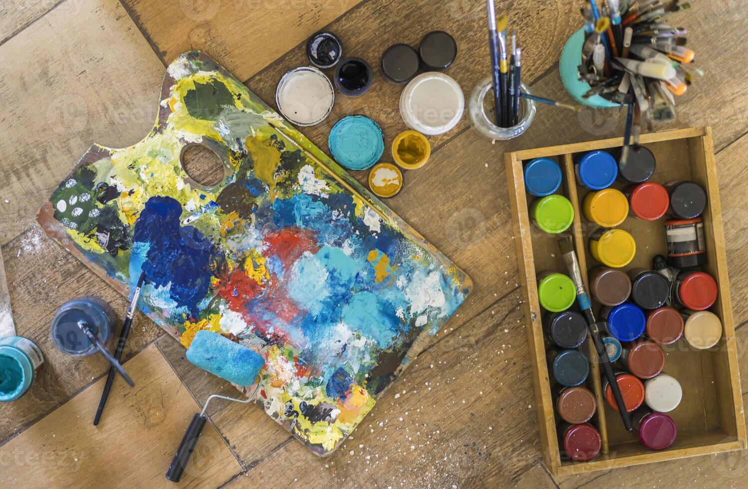 High angle view of brushes and paintings stuff photo