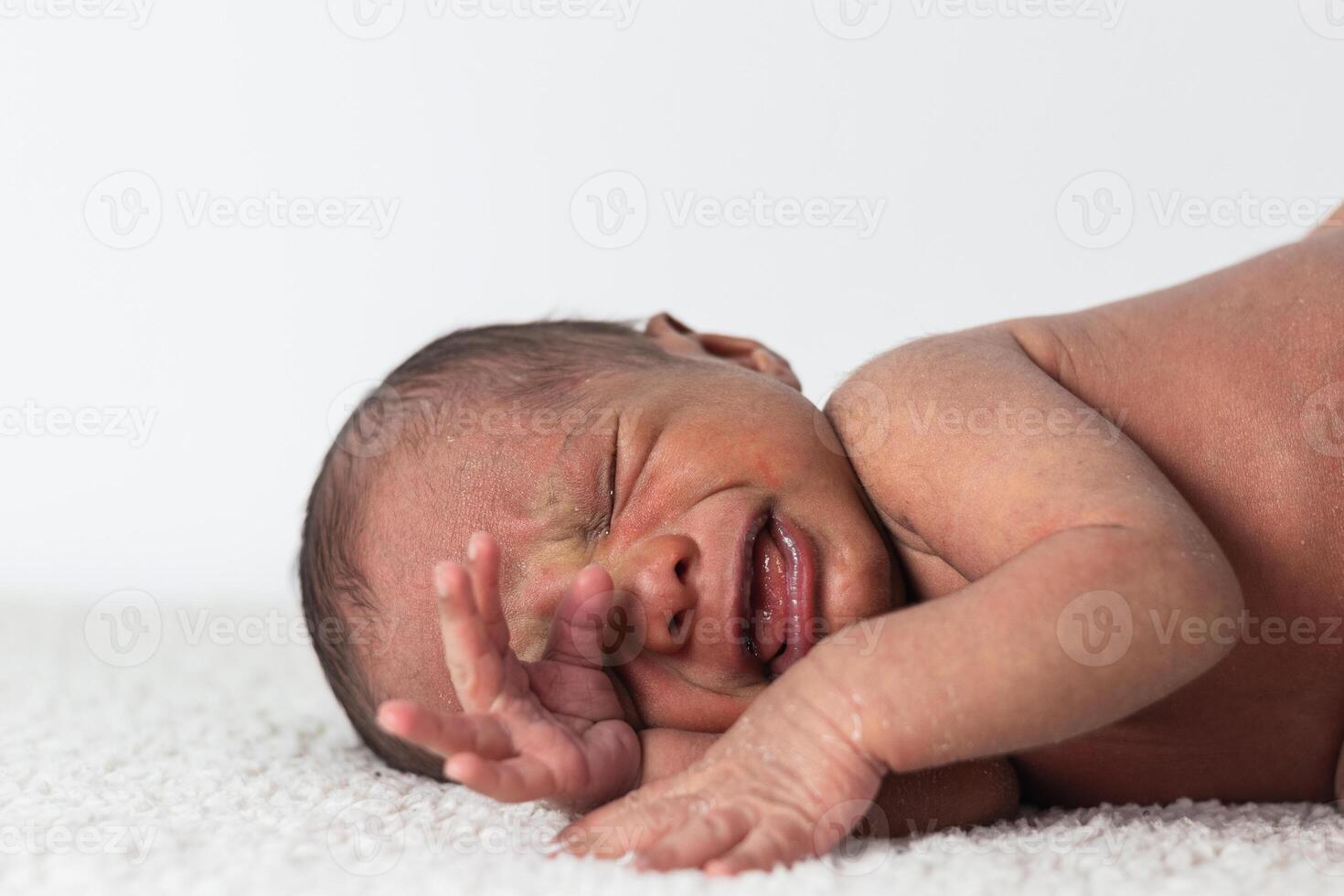 Newborn baby on soft blanket photo