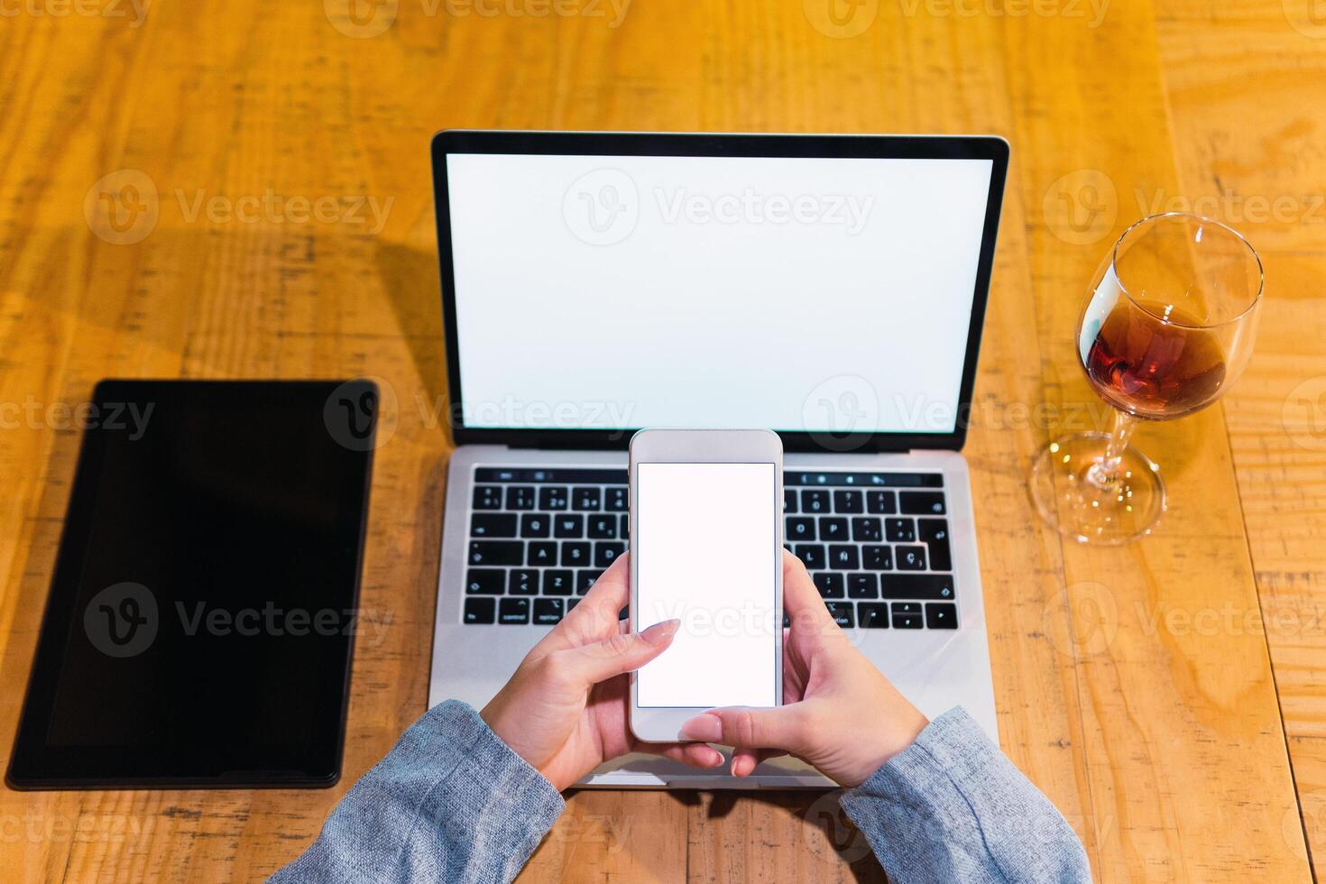 Crop woman using devices in restaurant photo
