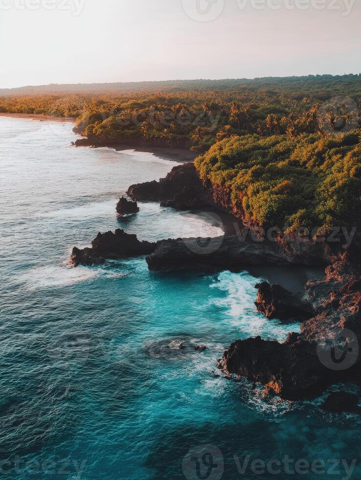 Beautiful aerial view of the ocean and the coastline at sunset photo