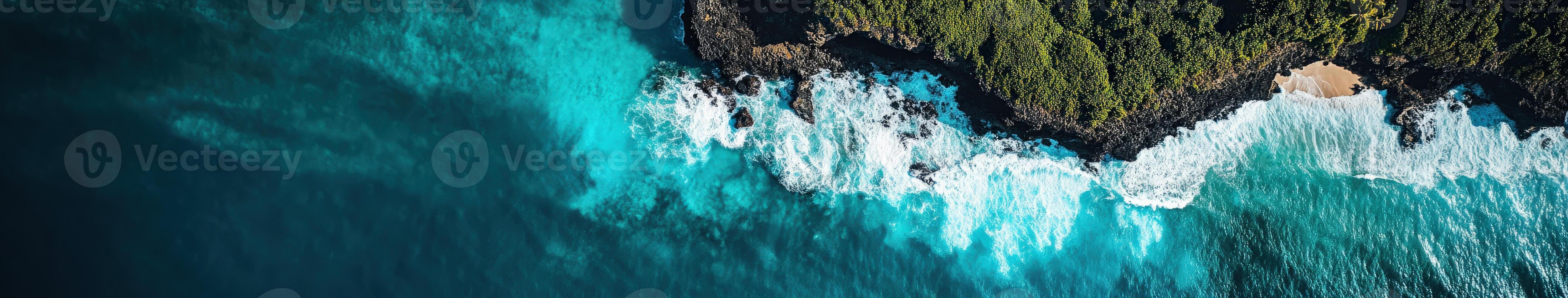 An aerial view of the ocean and trees photo