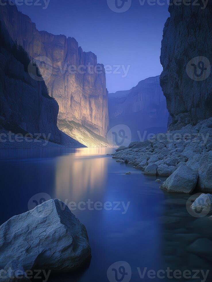 A river with rocks and water in the middle of a mountain photo