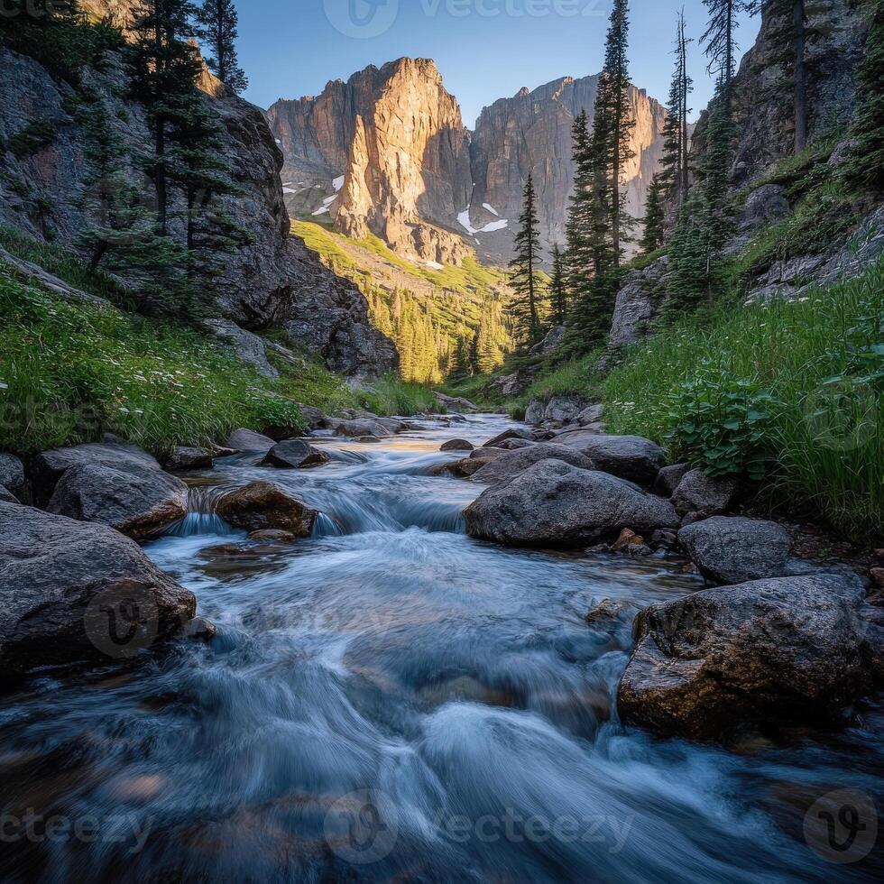 A stream runs through a rocky mountain valley photo