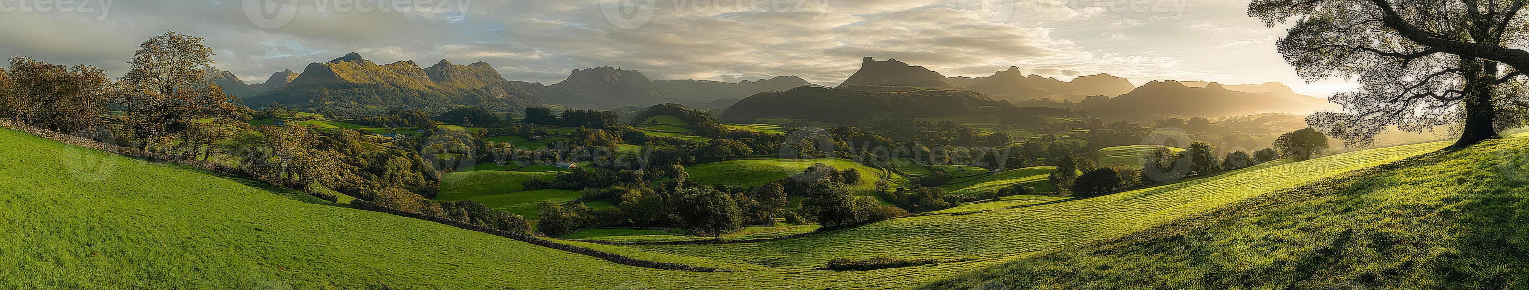 A panoramic view of a green valley with mountains photo