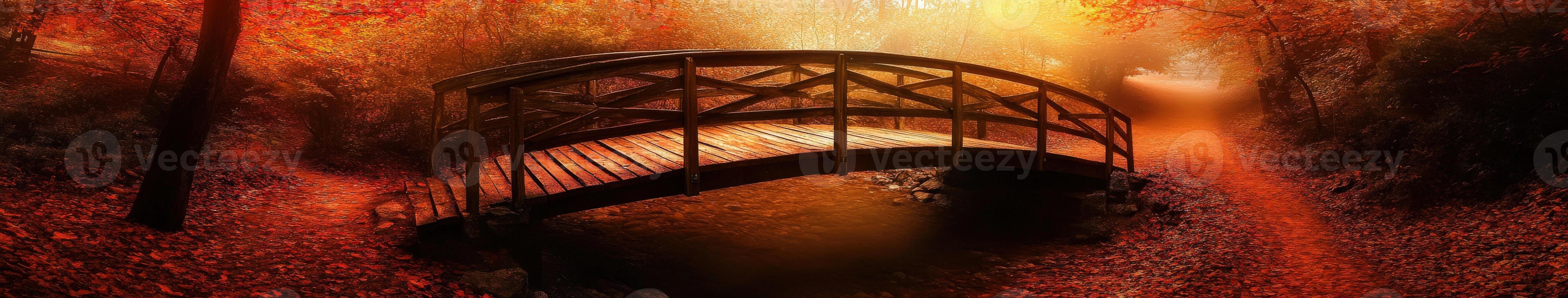 A bridge in the woods with red leaves photo
