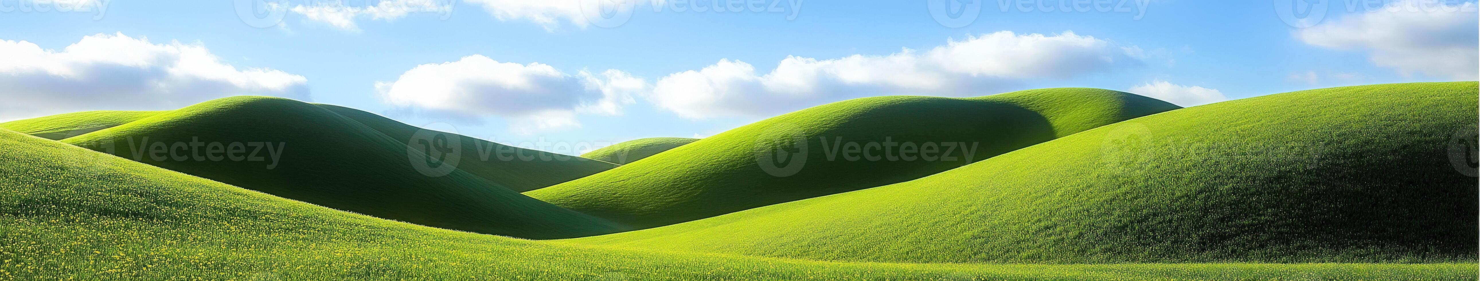 A green hill with grass and clouds photo
