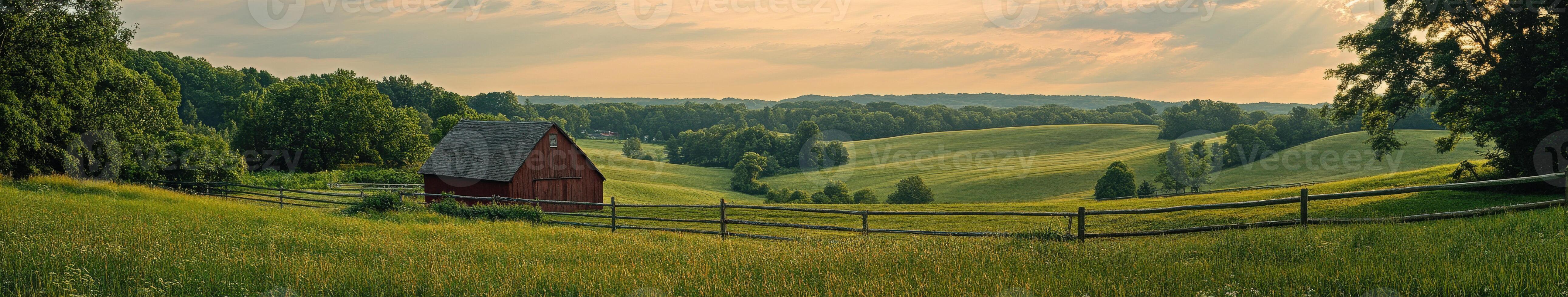 A red barn sits on a green hillside photo