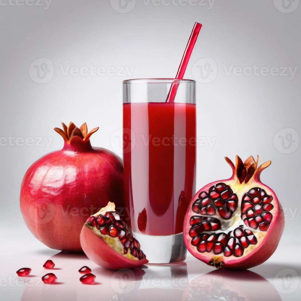 Tasty pomegranate juice in a glass. Ripe fresh pomegranate close-up. Whole fruit and pieces. Element of packaging and advertising design photo