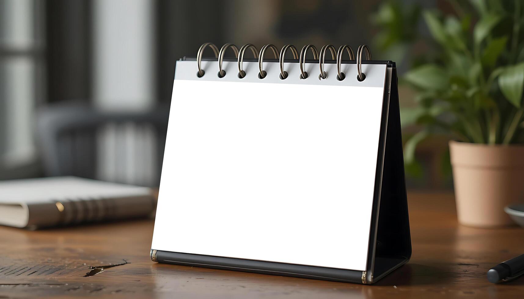Desk calendar mockup blank on table. Blank paper desk spiral calendar. business planning and corporate design concept. white desk calendar mockup blank. photo