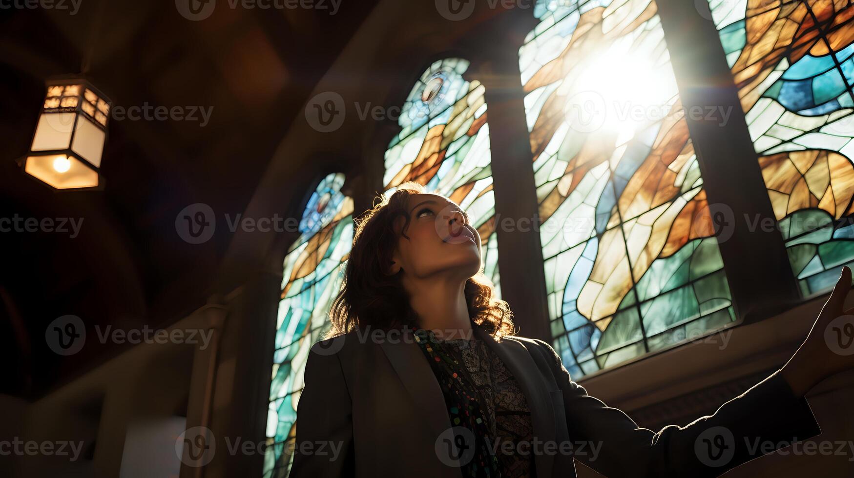 Stained glass windows are a beautiful way to let light into a bu photo