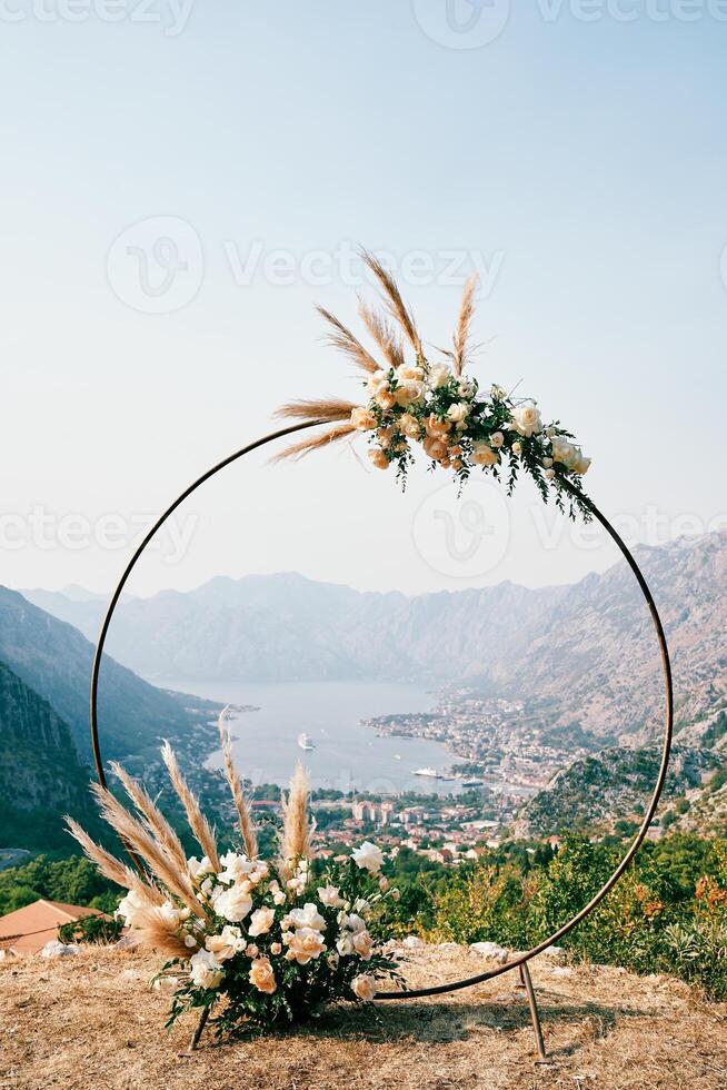 View through the round wedding arch standing on the mountain to the Bay of Kotor. Montenegro photo