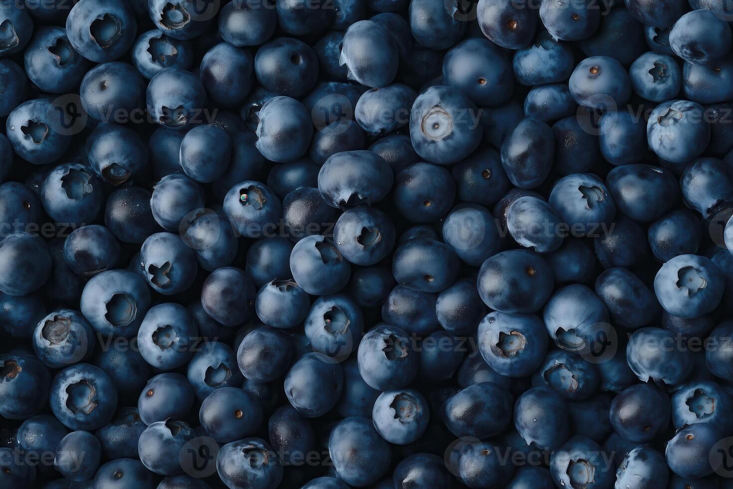 A bountiful pile of fresh, ripe blueberries creates a stunning, healthy food background. photo