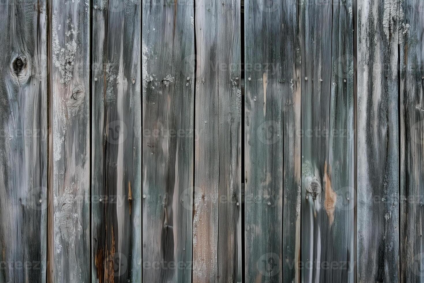 Close-up reveals a weathered wooden fence with rich textures and subtle grey and brown color variations. photo