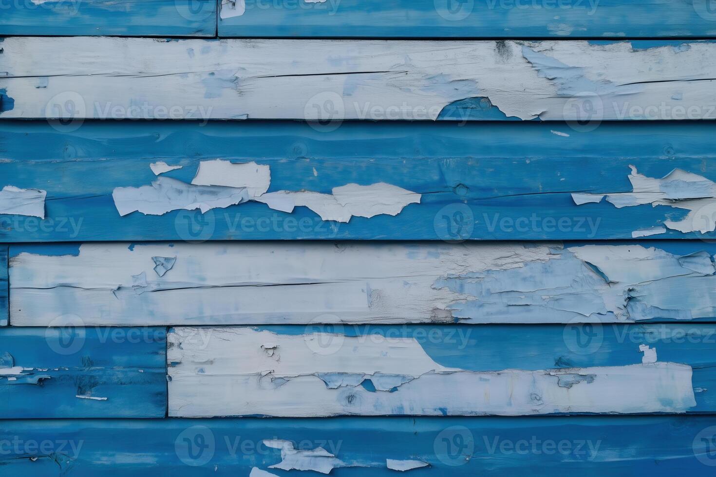 Weathered blue and white painted wood planks with peeling paint create a rustic, textured background. photo