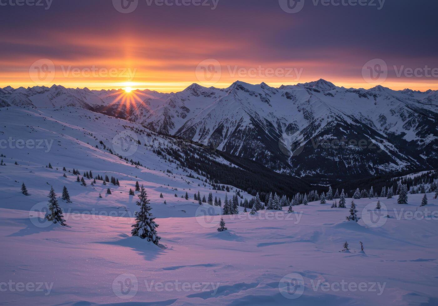 A breathtaking mountain landscape covered in snow with coniferous trees reflecting the colors of the sunset. photo