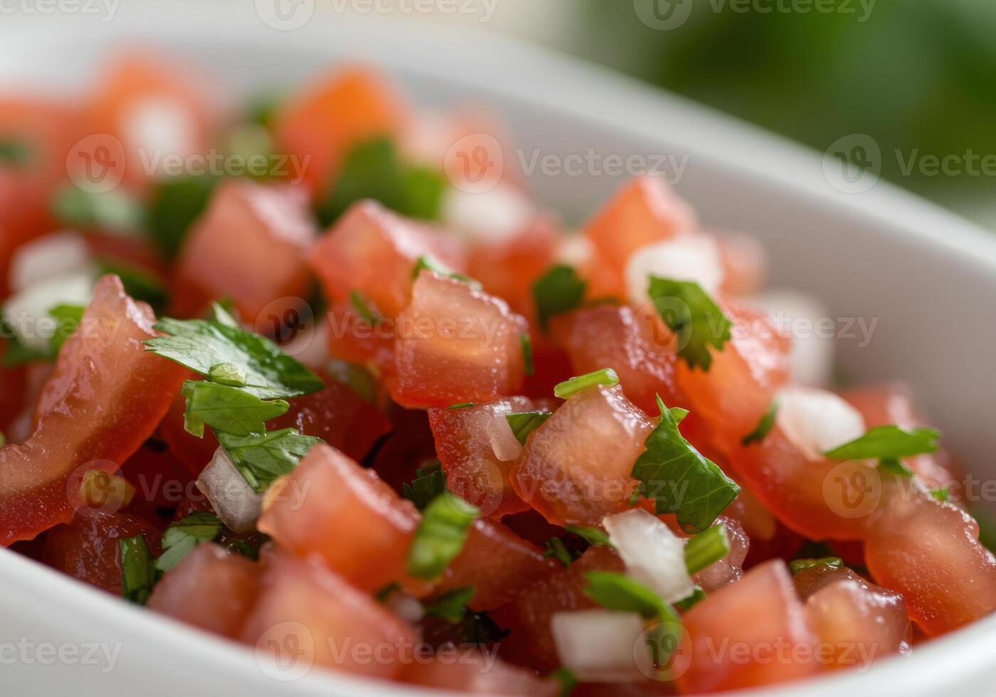 A close-up shows a vibrant bowl of homemade pico de gallo with fresh tomatoes, onions, and cilantro. photo