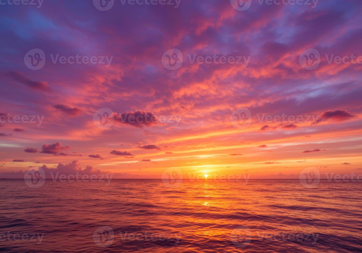 A breathtaking sunset over the ocean creates a stunning array of colors in the sky. photo