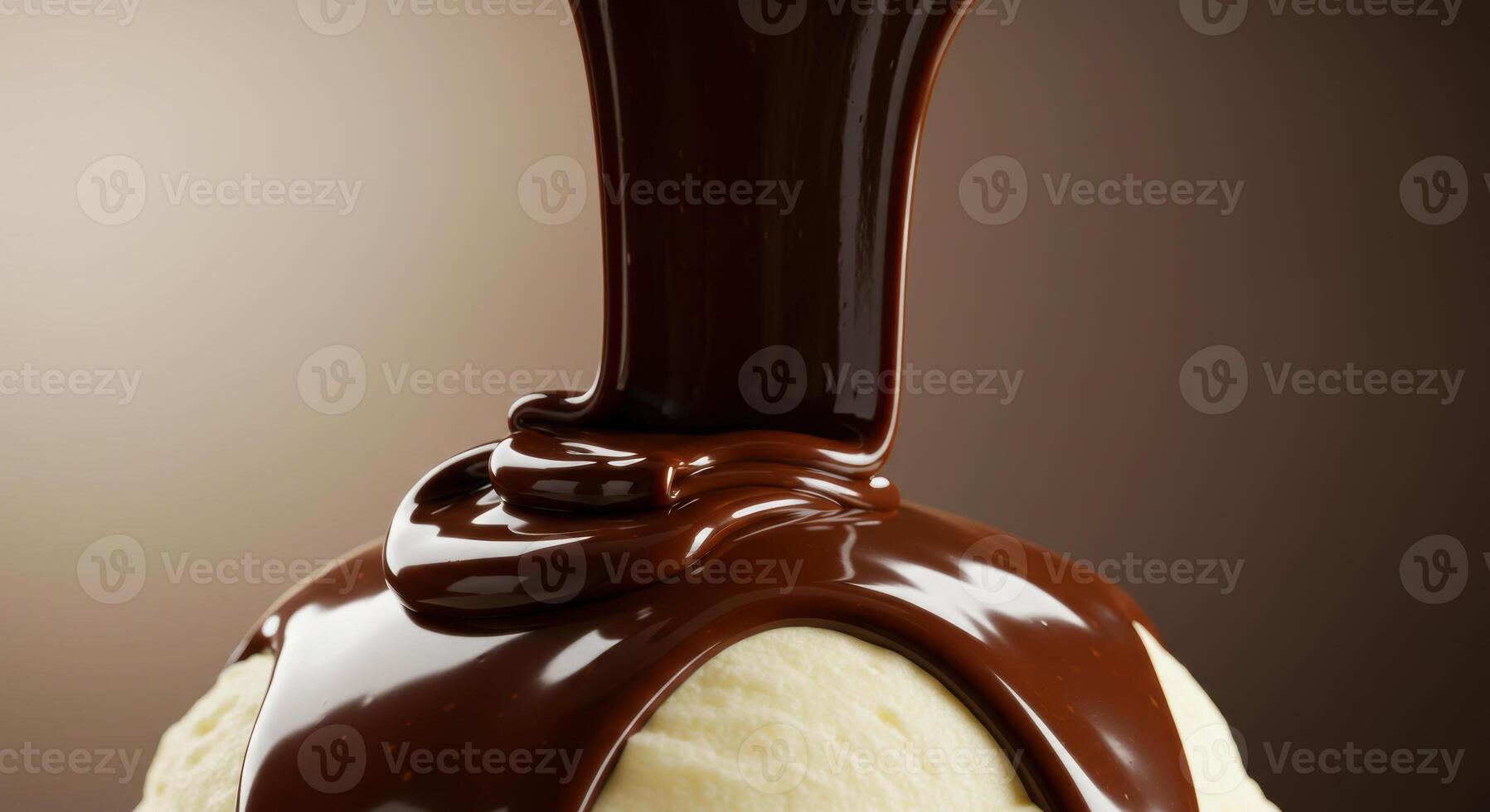 Indulge in a scoop of vanilla ice cream covered with rich, dark chocolate syrup. photo