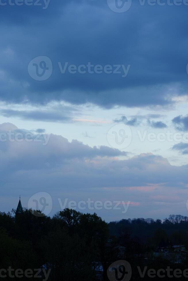dark blue cloudy sky background photo