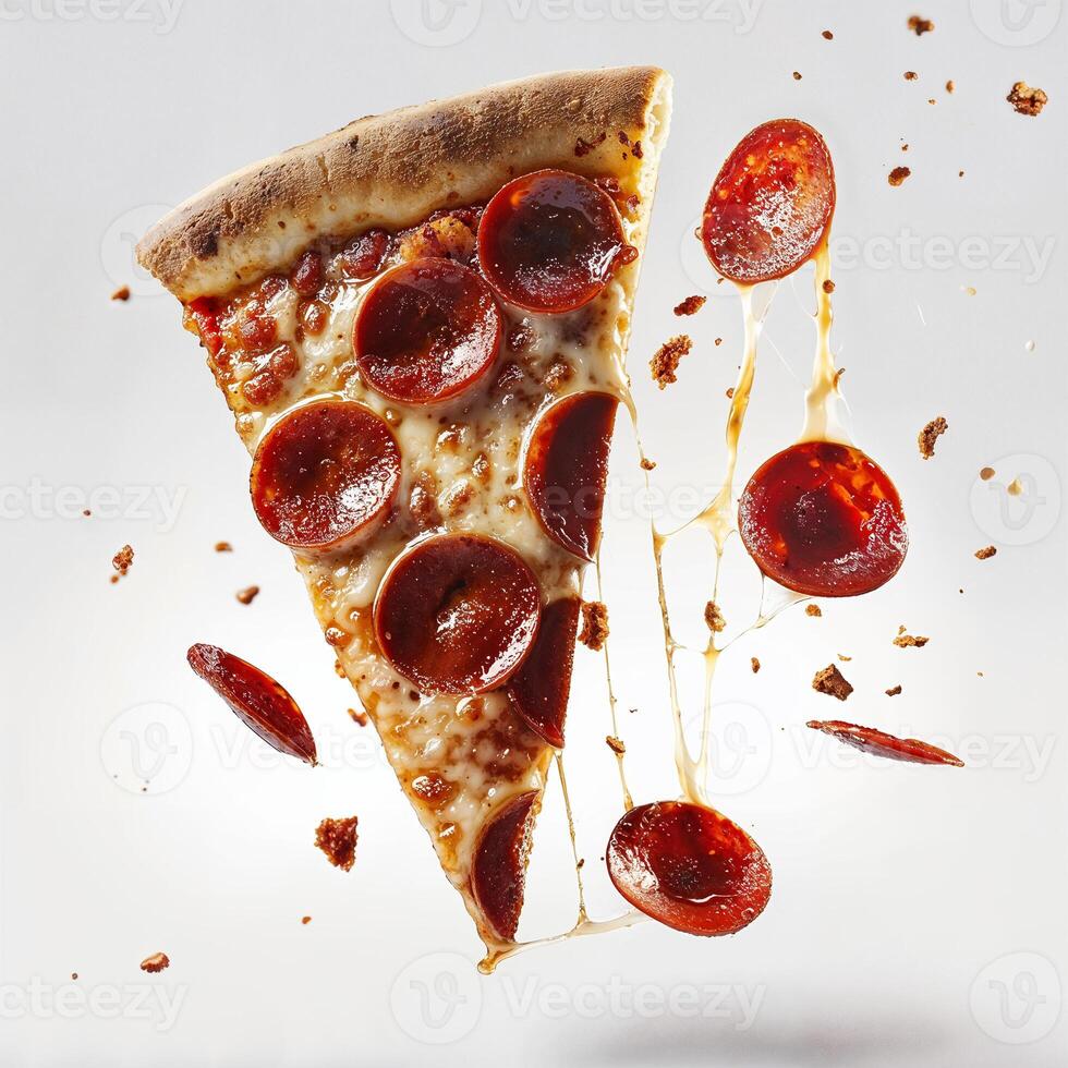 A single slice of pepperoni pizza with melted cheese and salami on a white background. photo