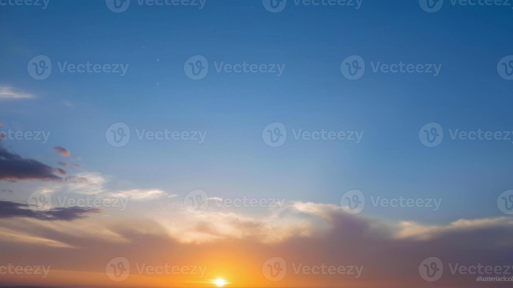 Beautiful Sunset Over Horizon with Soft Clouds and Clear Sky photo