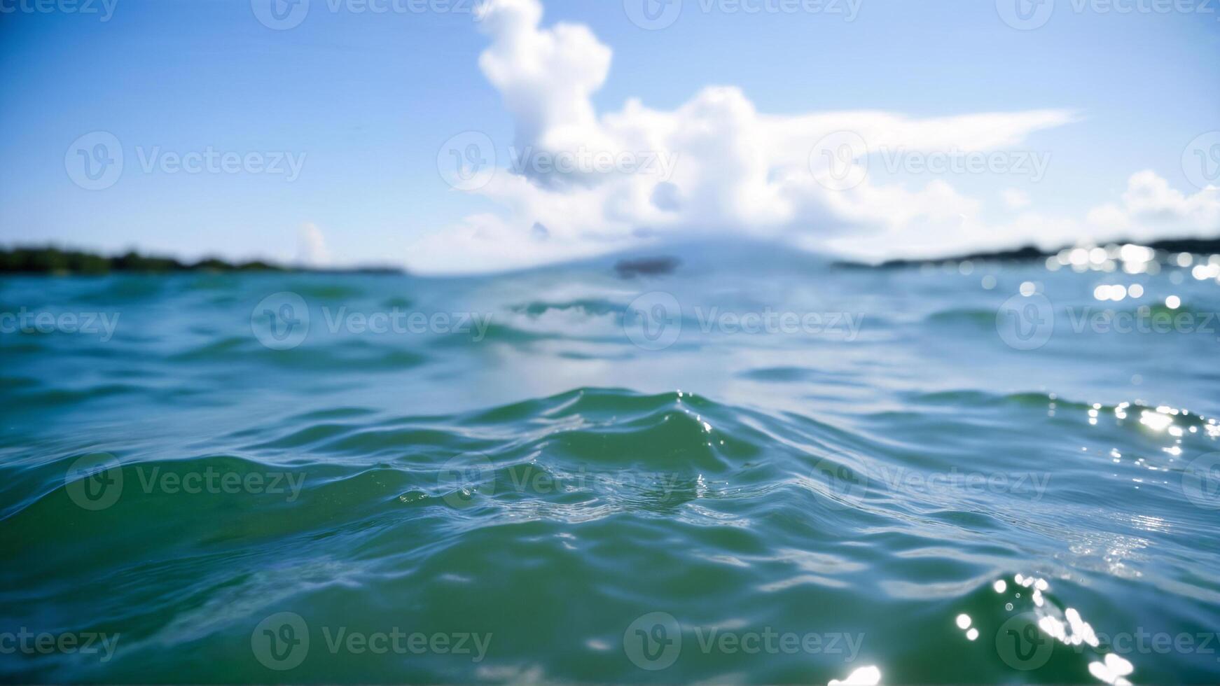 Serene Ocean Waves Under a Blue Sky with Fluffy Clouds photo
