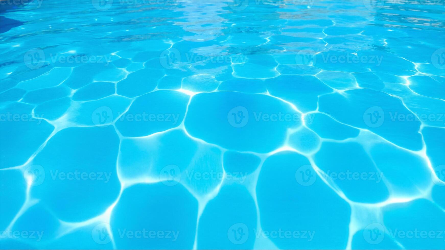 Crystal Clear Water Patterns in a Swimming Pool Under Sunlight photo