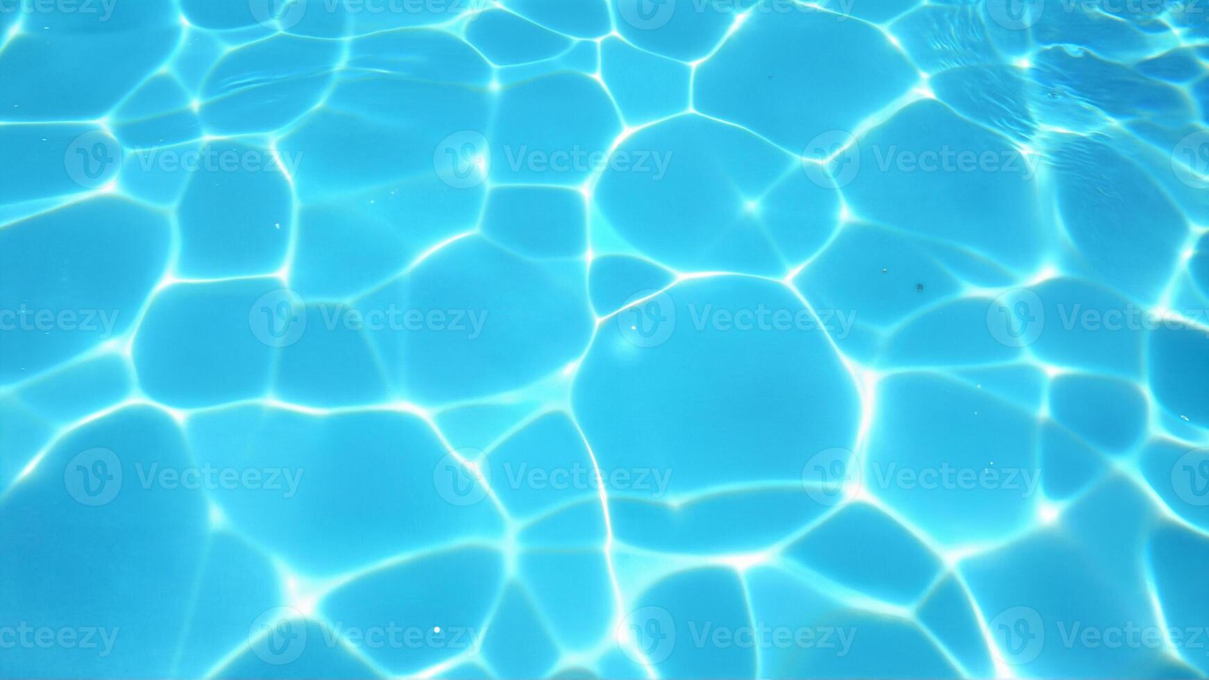 Bright Blue Water Surface with Soothing Sunlight Patterns photo