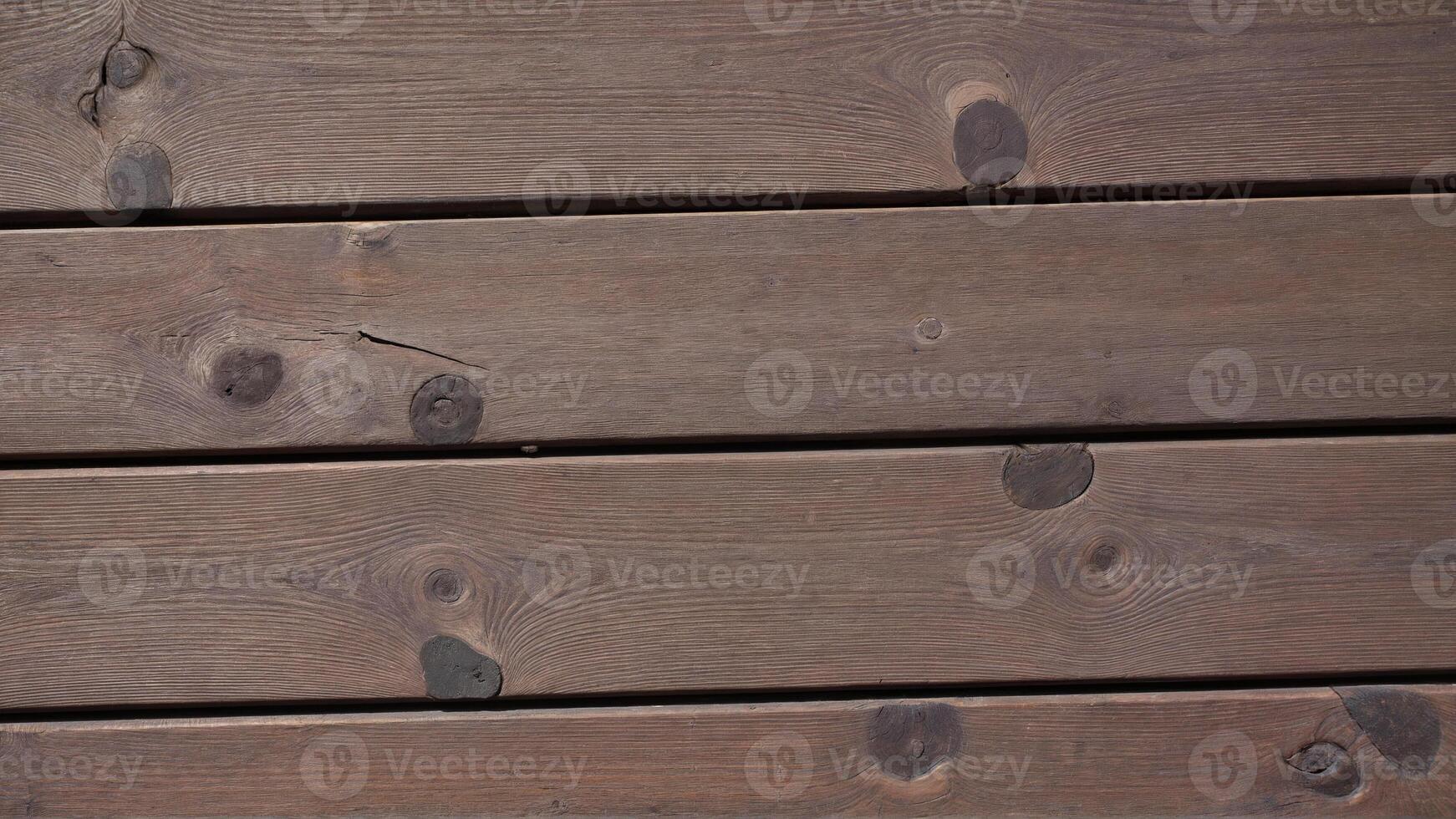 Textured Brown Wooden Planks with Distinctive Knots and Grain Patterns photo