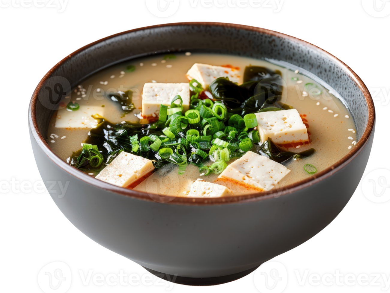 Delicious bowl of creamy miso soup with tofu, seaweed, and fresh green onions on a bright background png
