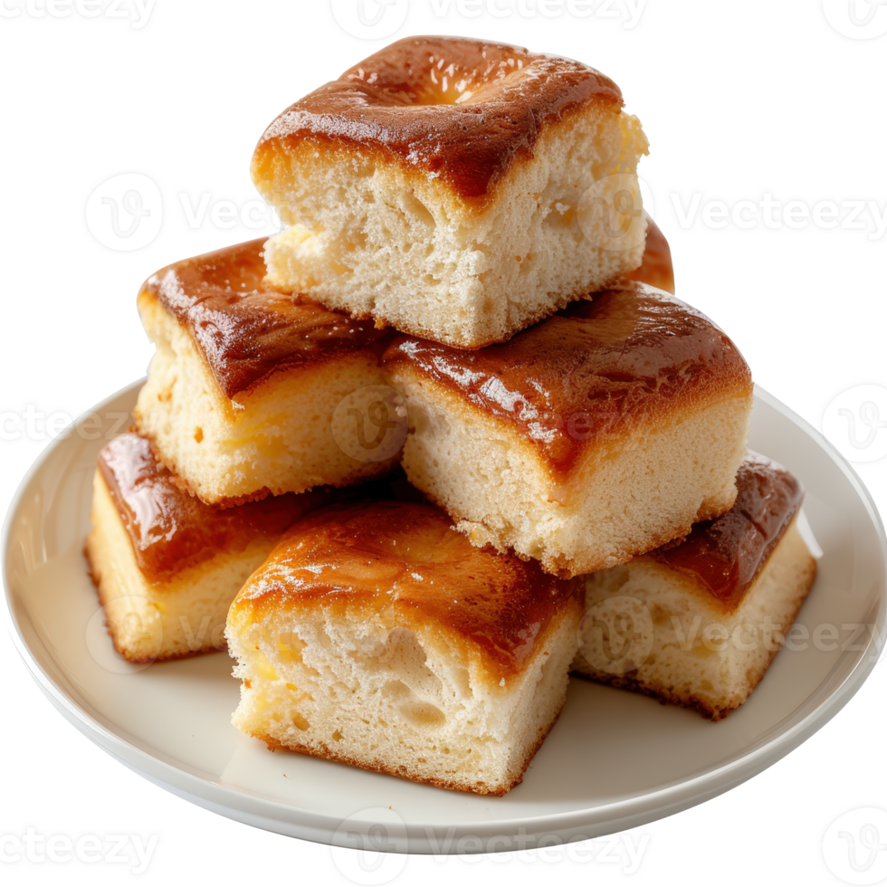 Deliciously Soft Cake Squares Piled on a White Plate with Golden Glaze Finish and Moist Texture png
