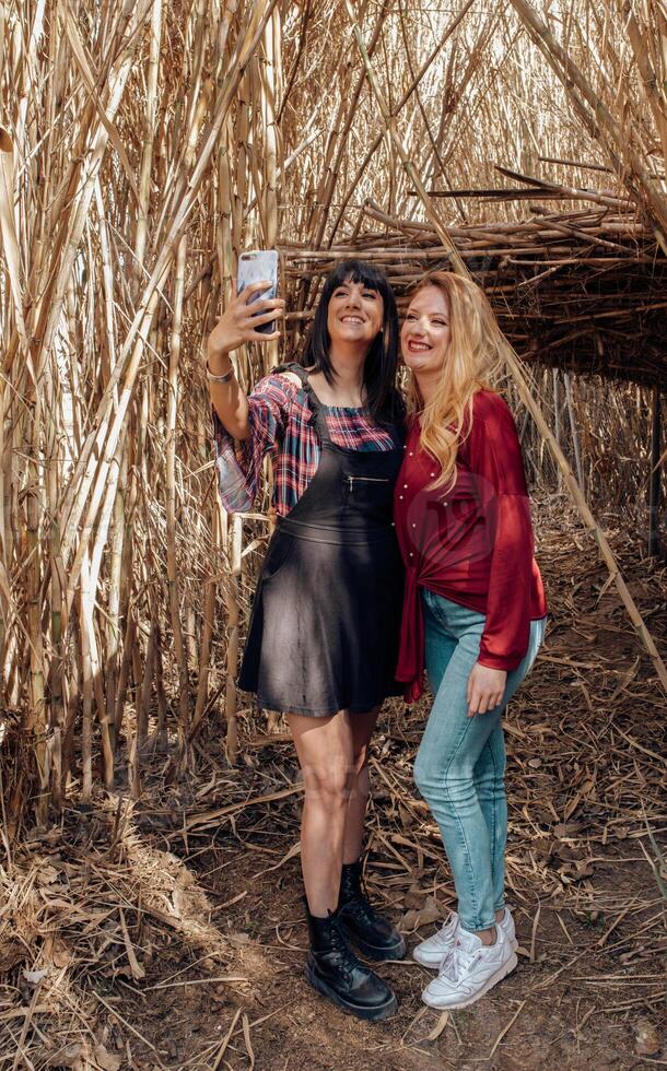 Young women looking in smartphone photo