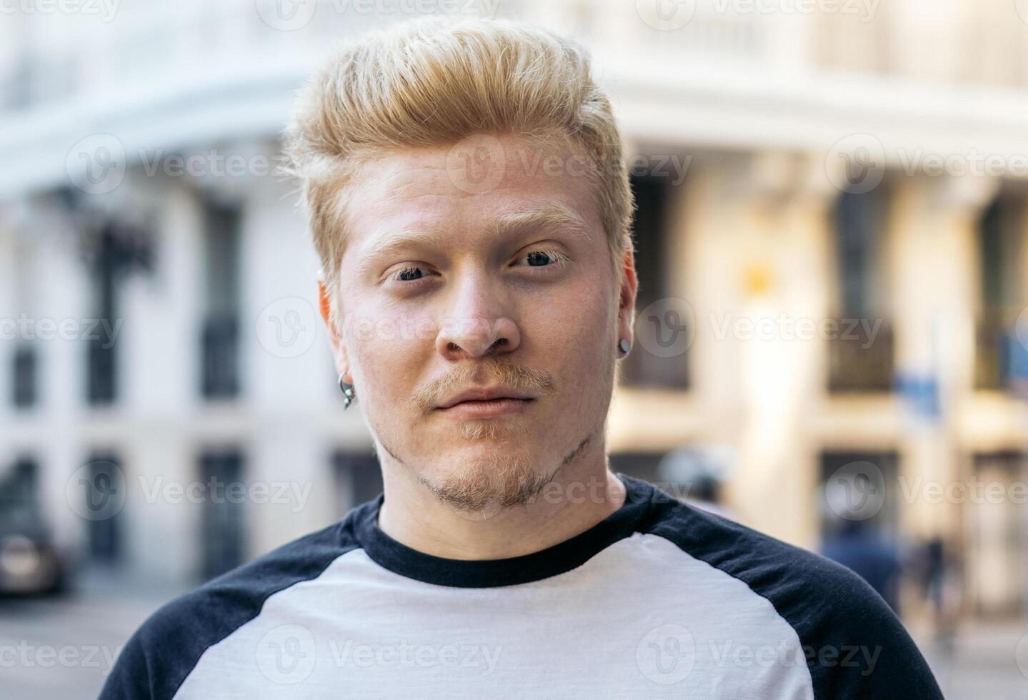 Close-up of albino latino man in the city street. photo