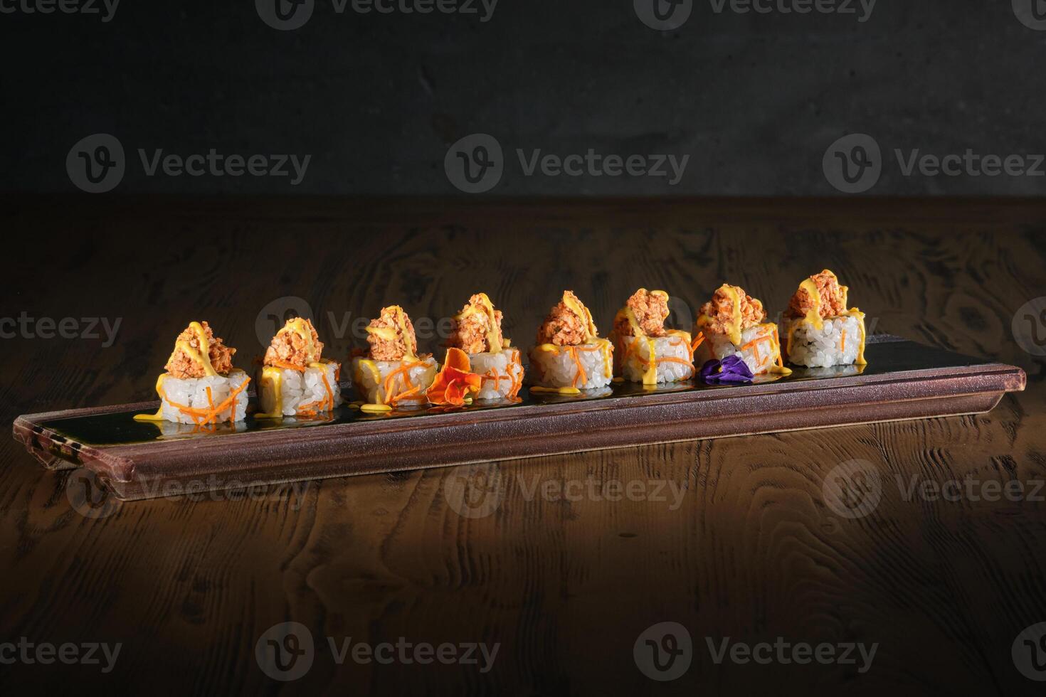 Delicious sushi served on plate in restaurant photo
