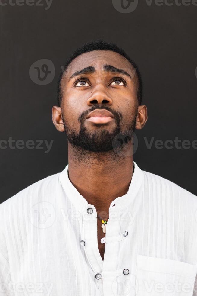 Black man in trendy clothes in city photo