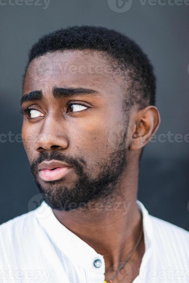 Black man in trendy clothes in city photo