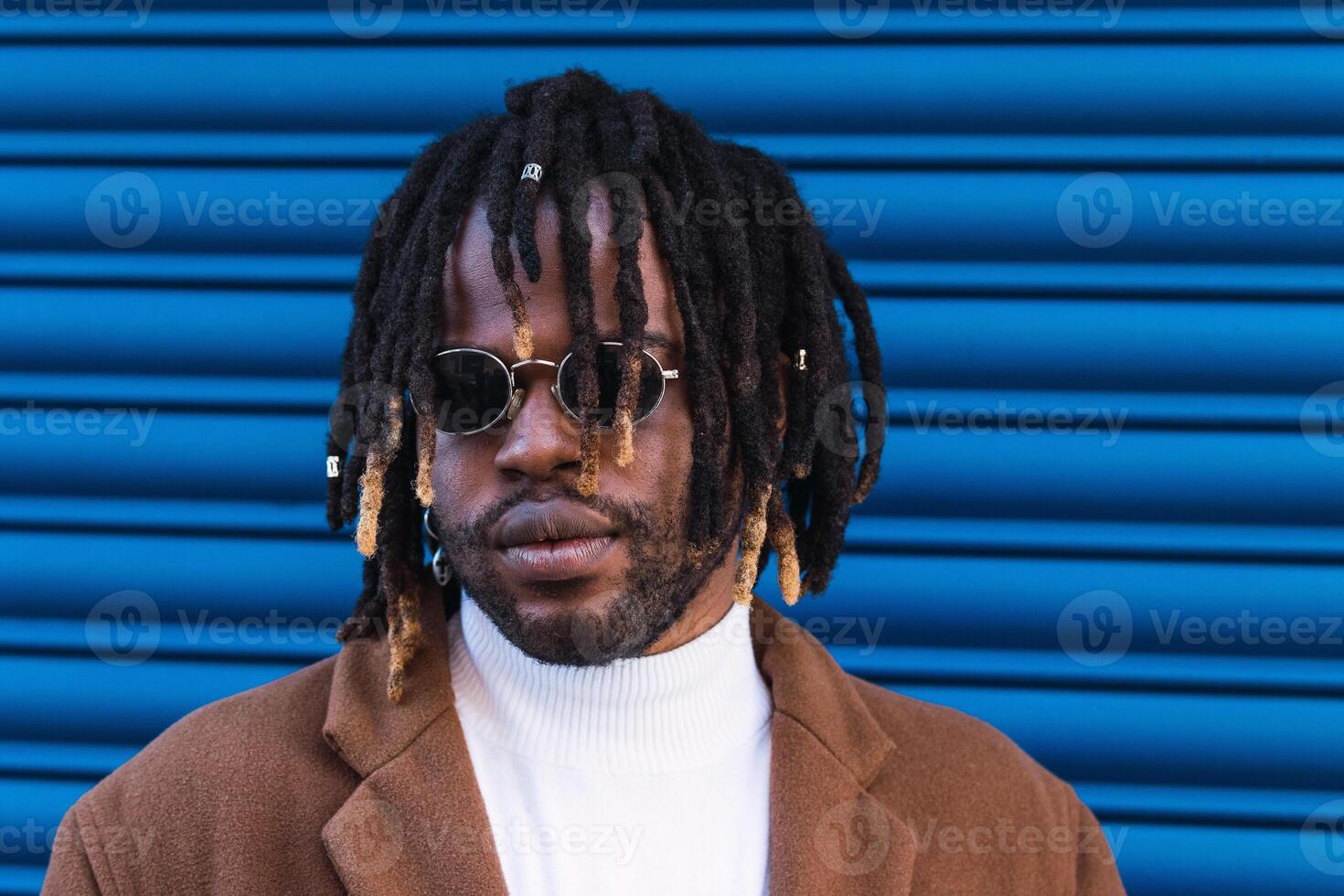 Black man in trendy sunglasses in city photo