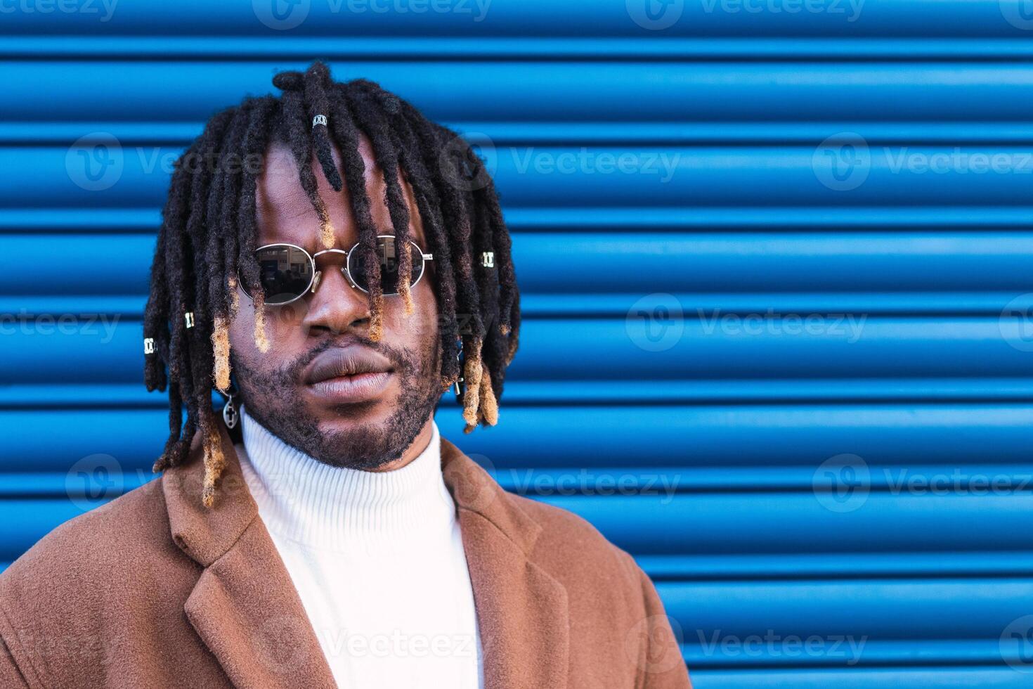 Black man in trendy sunglasses in city photo