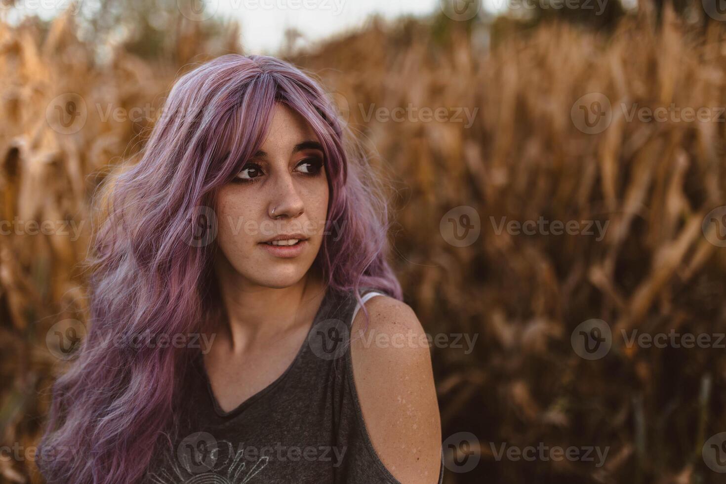 Beautiful casual woman in dry vegetation photo