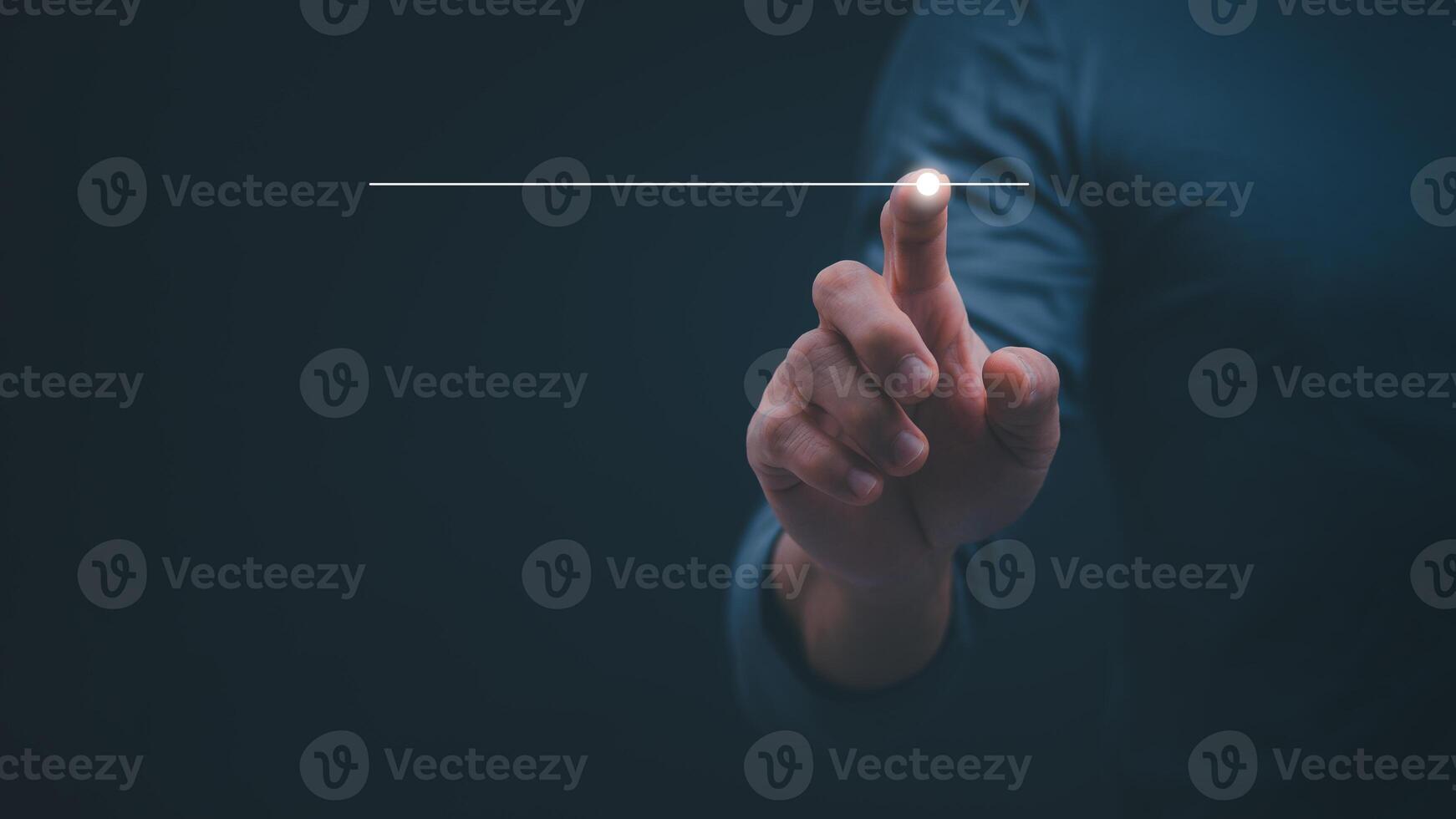 a person is pointing at a button with a line on it photo