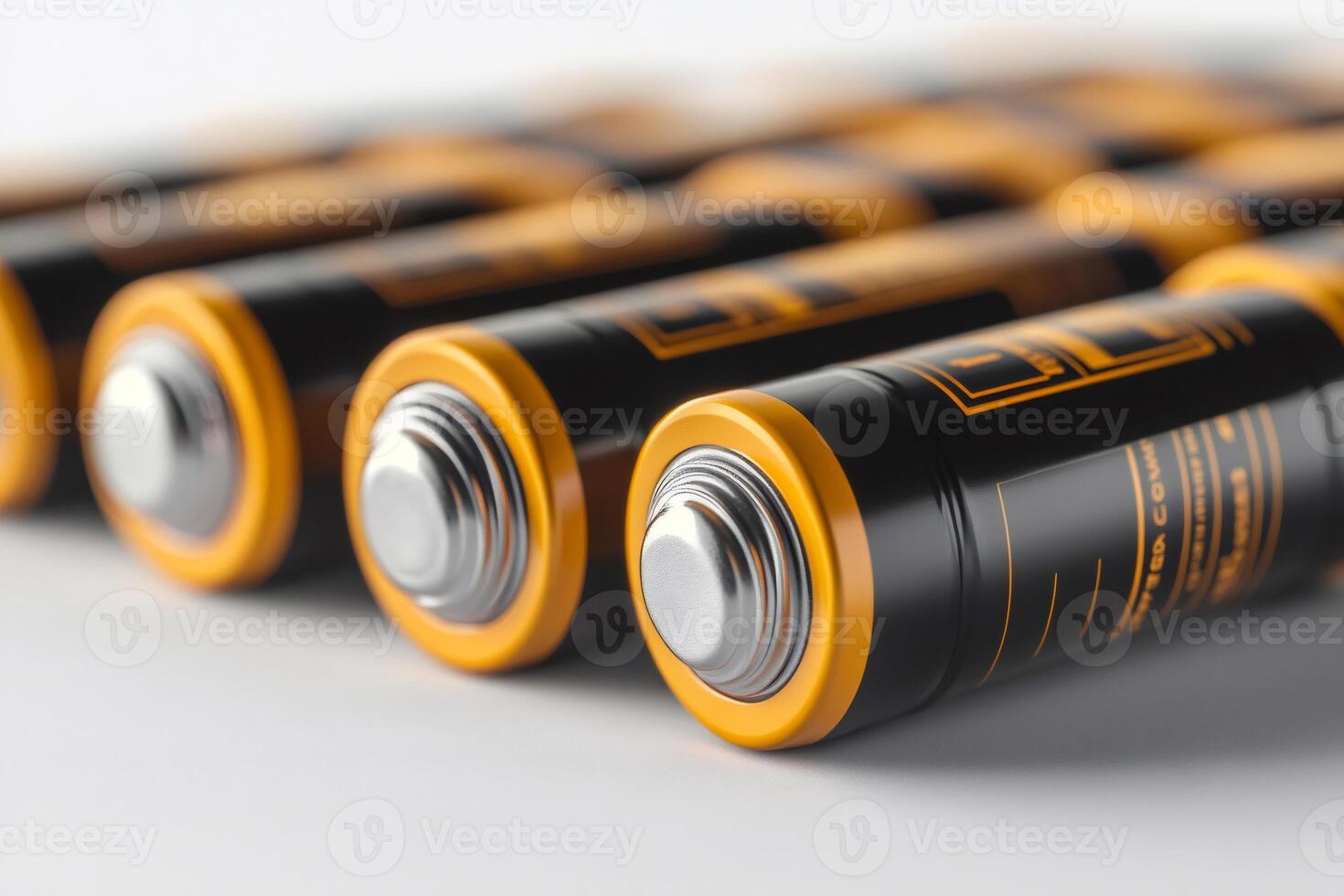Row of batteries lying on white background providing portable power photo
