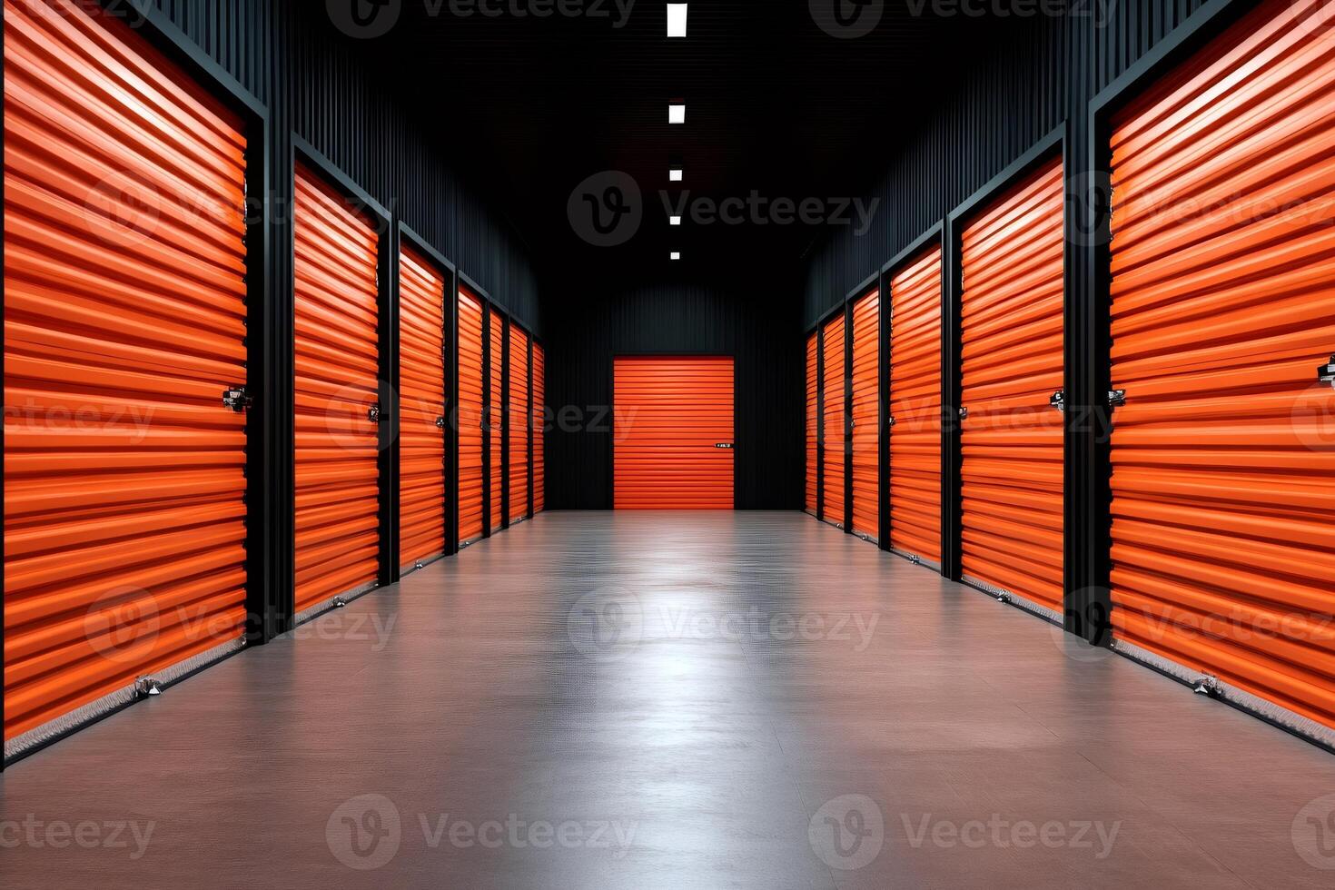 Long corridor with orange storage units and concrete floor photo