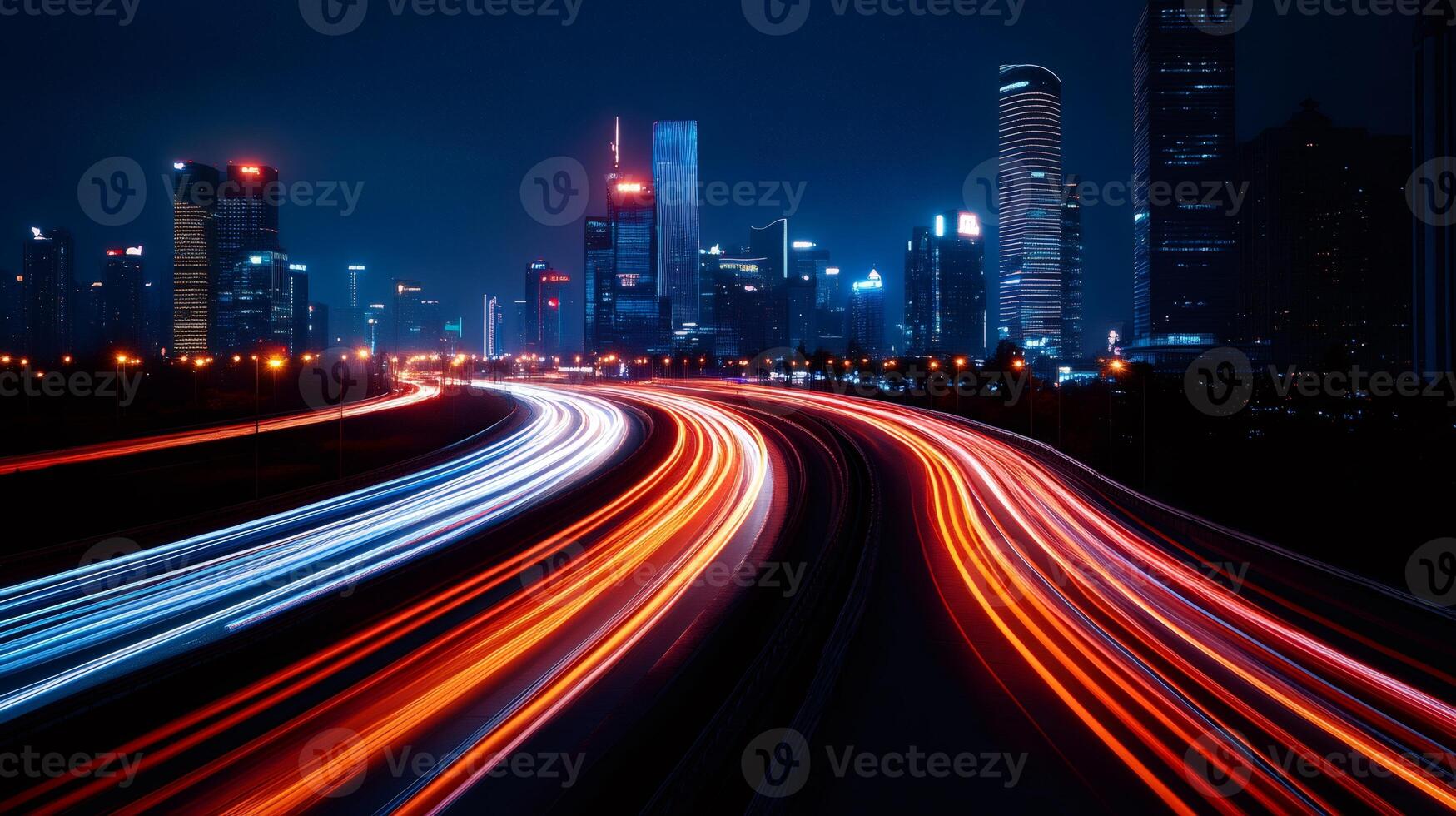 Light trails illuminating a highway at night with a cityscape in the background photo