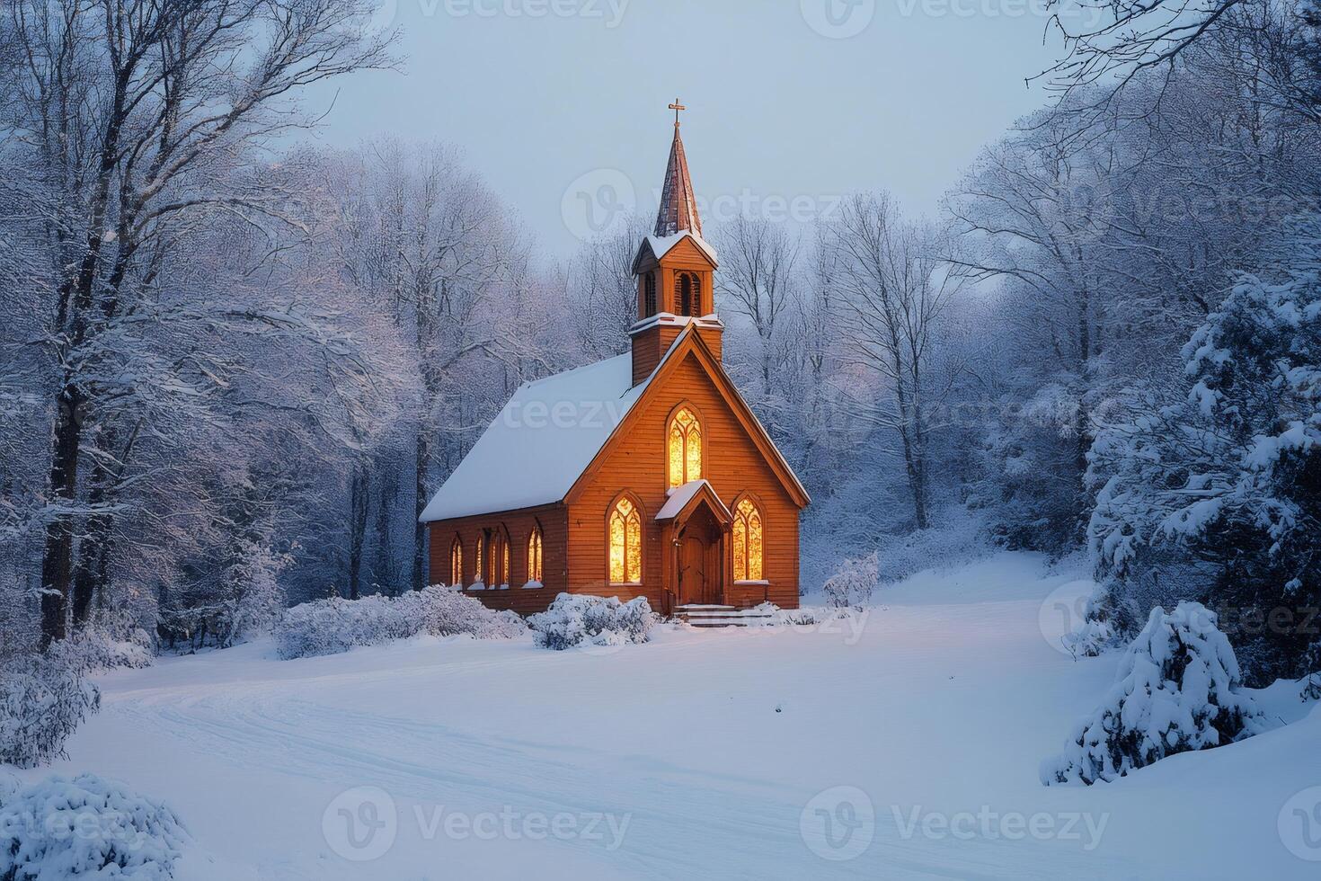 Warm wooden church illuminating snowy winter landscape at dusk photo