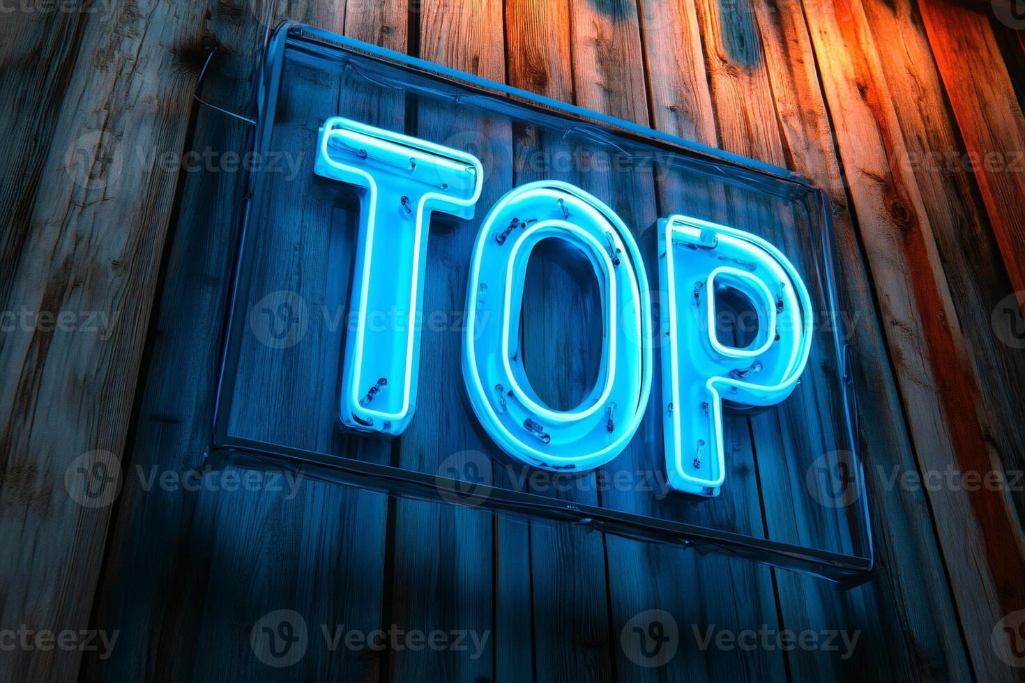 Bright blue neon sign spelling top on wooden wall photo